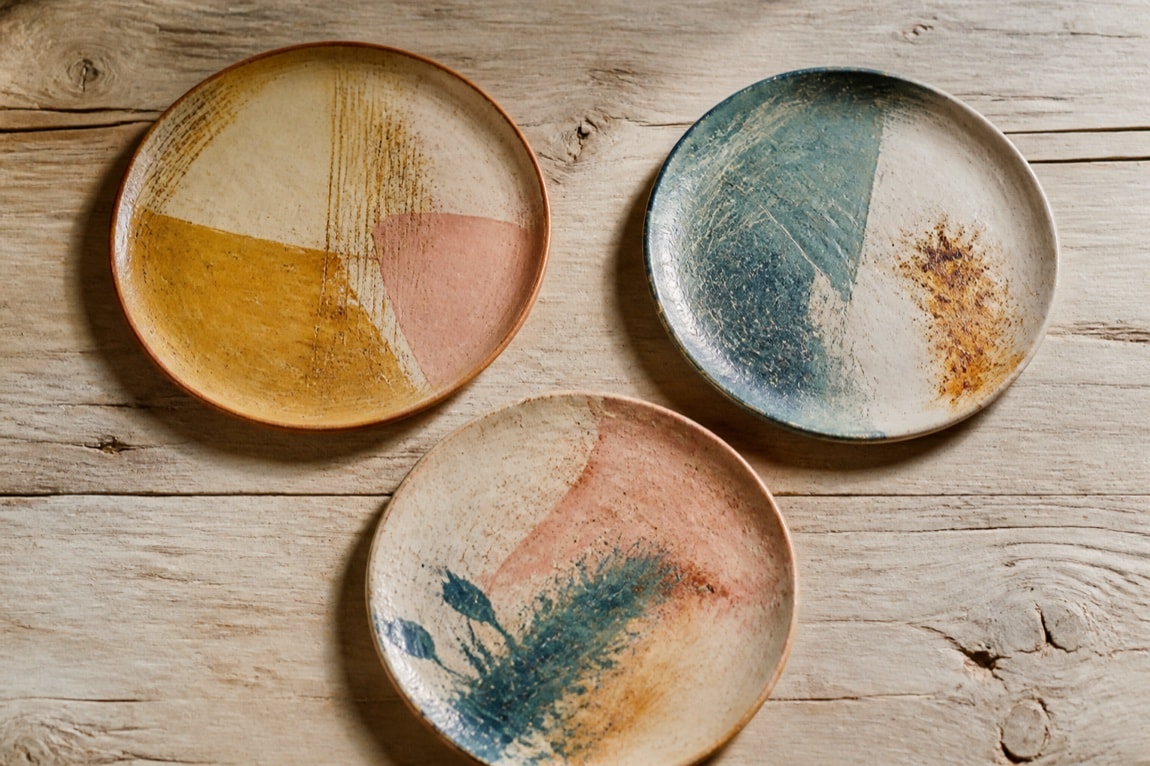 arrangement of three generic decorated ceramic plates